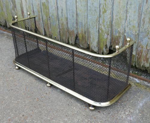 A Victorian Brass and Iron Club Fender