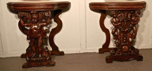 A Pair of 19th Century Ornately Carved Walnut Rocco Console Tables
