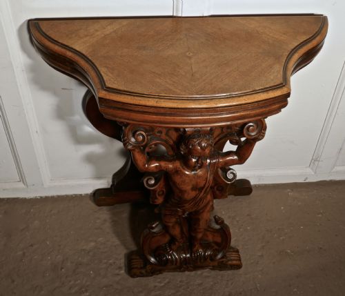 fig 2. A pair of 19th Century Ornately Carved Walnut Rocco Console Tables