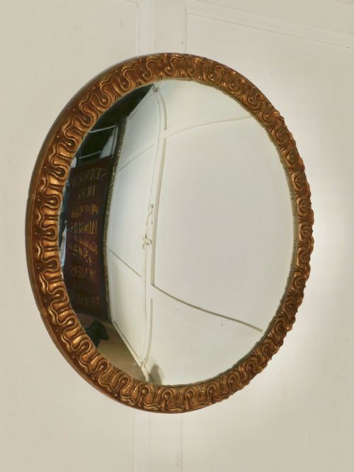 A Large Art Deco Convex Gilt Wall Mirror 


