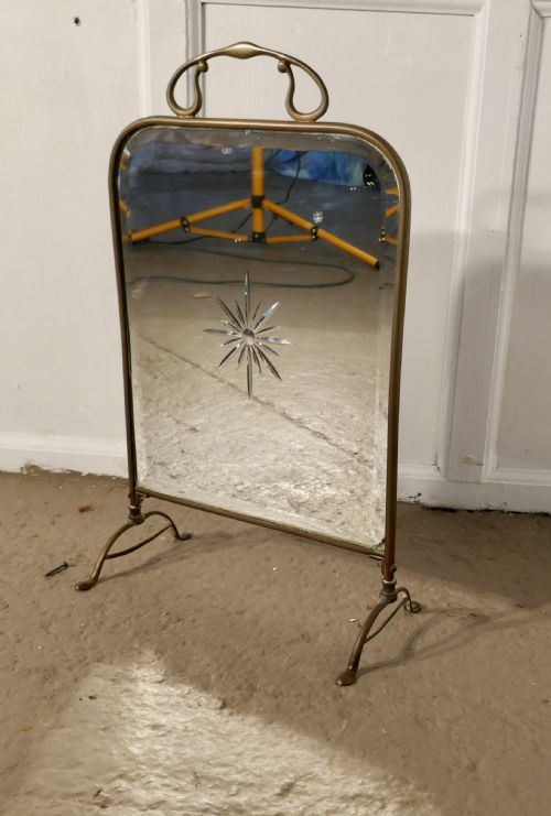 fig 1. A Victorian Art Nouveau Brass and Sunburst Mirror Fire Screen