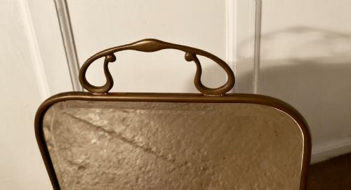 fig 2. A Victorian Art Nouveau Brass and Sunburst Mirror Fire Screen