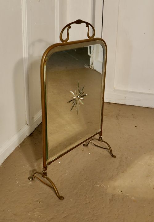 fig 3. A Victorian Art Nouveau Brass and Sunburst Mirror Fire Screen