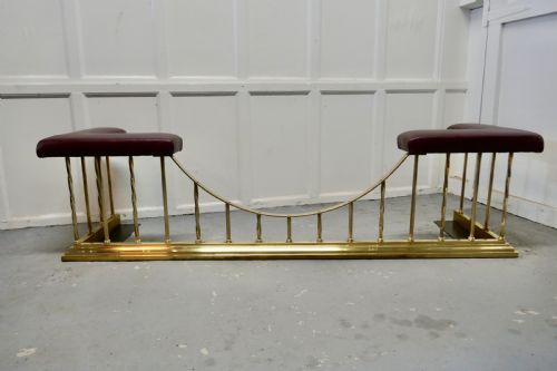 A Superb Large Brass and Leather Club Fender