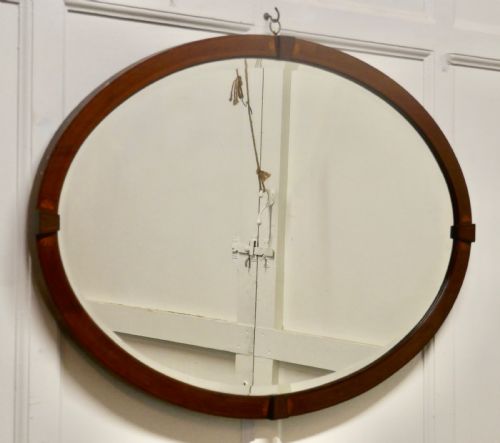 A Large Edwardian Inlaid Mahogany Oval Mirror