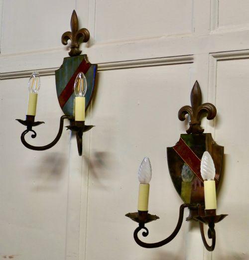 A Pair of Wrought Iron Heraldic Shield Shaped Girandole Wall Mirrors