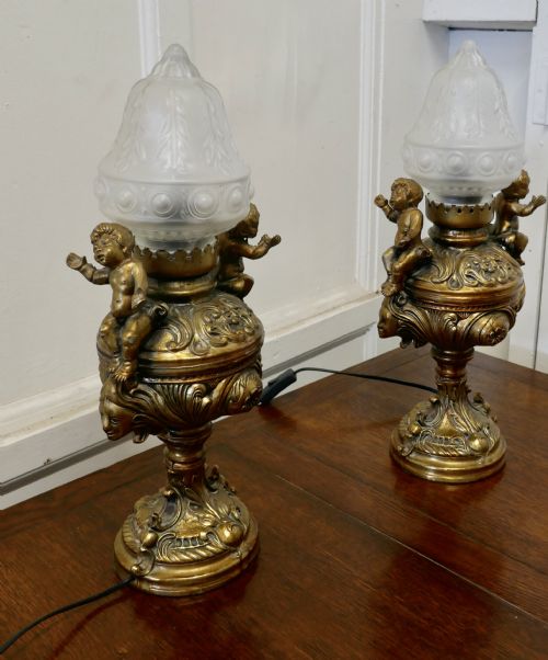 fig 1. A Pair of 19th Century French Gilt Lamps in the form of Cherubs or Putti