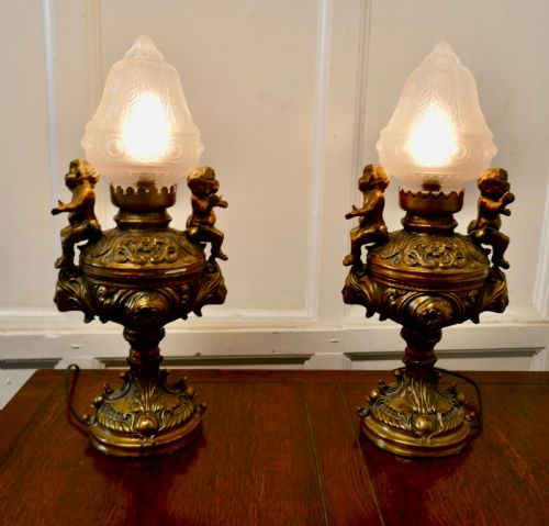 fig 3. A Pair of 19th Century French Gilt Lamps in the form of Cherubs or Putti