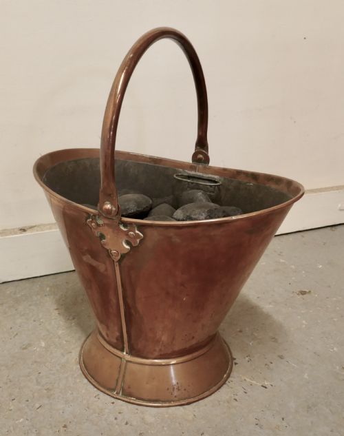 An Art Nouveau Copper Helmet Coal Scuttle with Liner