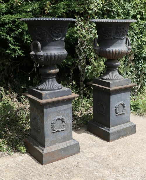A Pair of Large Cast Iron Urns, Garden Planters on Plinths