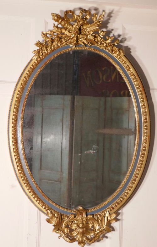 A Large French Rococo Oval Gilt Wall Mirror
