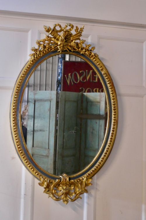 fig 1. A Large French Rococo Oval Gilt Wall Mirror