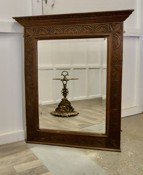 A Very Large Carved Oak Overmantel or Wall Mirror