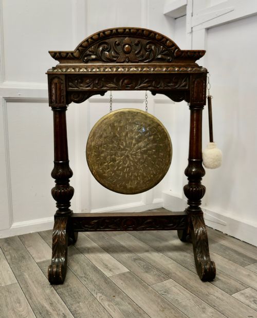 A Large Gothic Carved Oak and Brass Dinner Gong