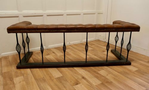 A Large Wrought Iron and Leather Club Fender
