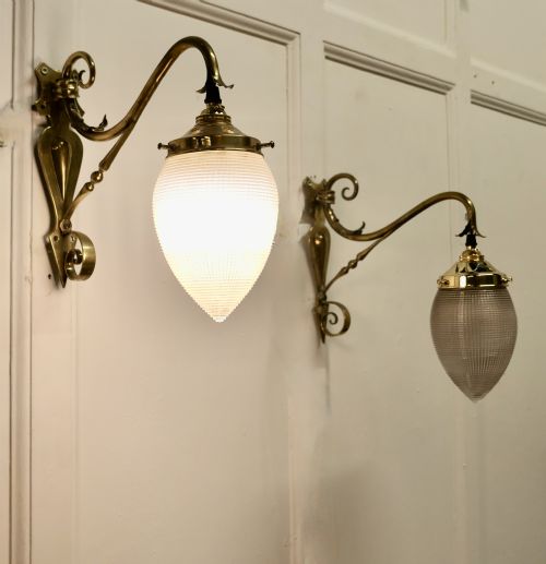 A Pair of Victorian Arts and Crafts Brass Swan Neck Wall Lights,