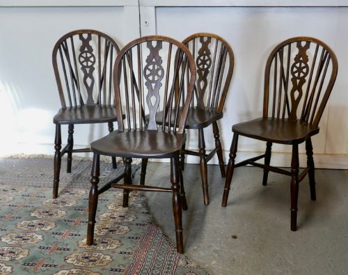 A Set of 4 Beech & Elm Wheel Back Windsor Kitchen Dining Chairs