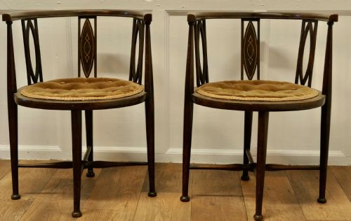 A Pair of Edwardian Circular Arm Chairs