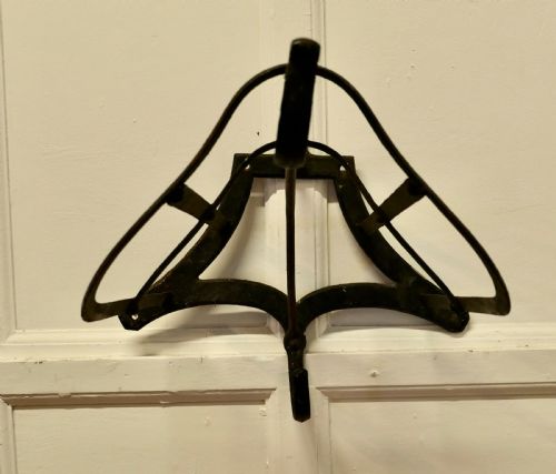 ANTIQUE IRON WALL HANGING SADDLE RACK