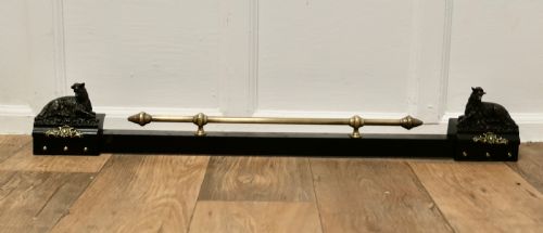 A BRASS AND IRON COUNTRY HOUSE FENDER WITH MOUNTAIN GOATS
