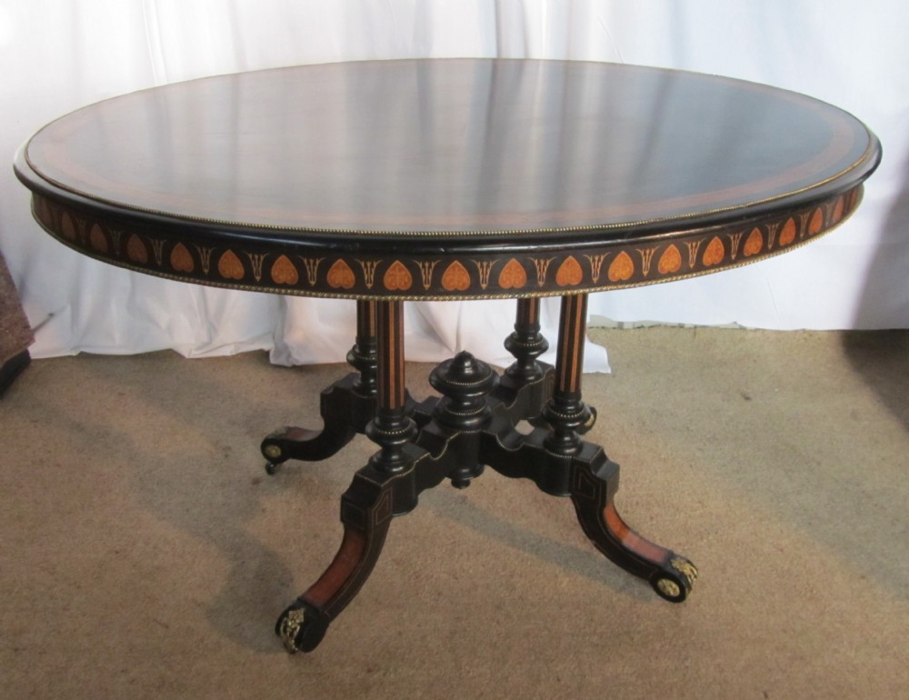 A Large Regency Style Ebonised Inlaid Breakfast Table 