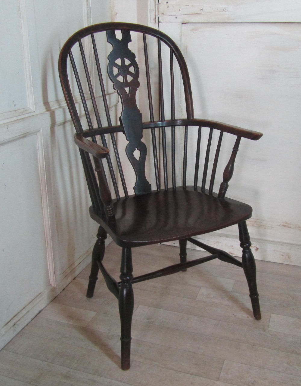 A Georgian Elm and Ash Wheel Back Windsor Carver Chair