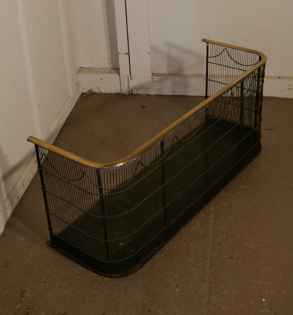 A Georgian Brass and Iron Club Fender or Nursery Fire Guard