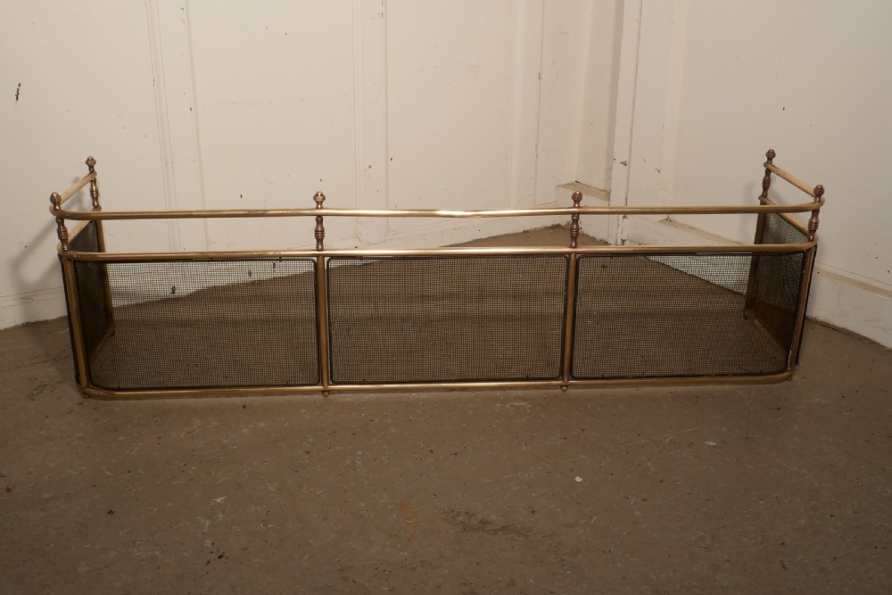 A Large Victorian Brass Club Fender 