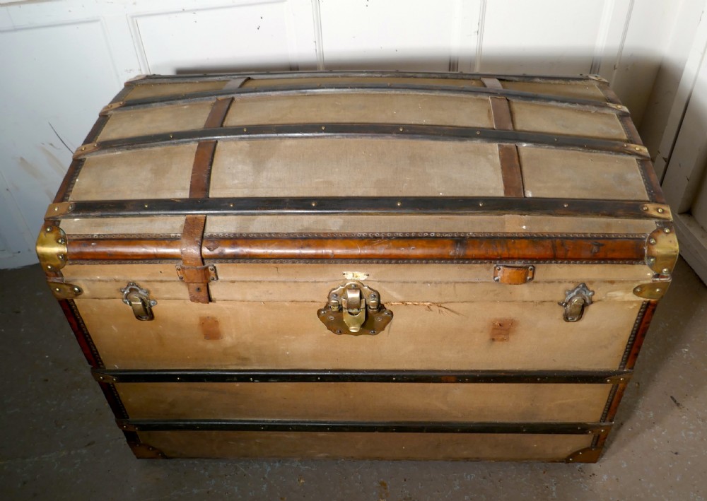 A Large 19th Century French Canvas Dome Top Travel Trunk, Lion Brand View VI