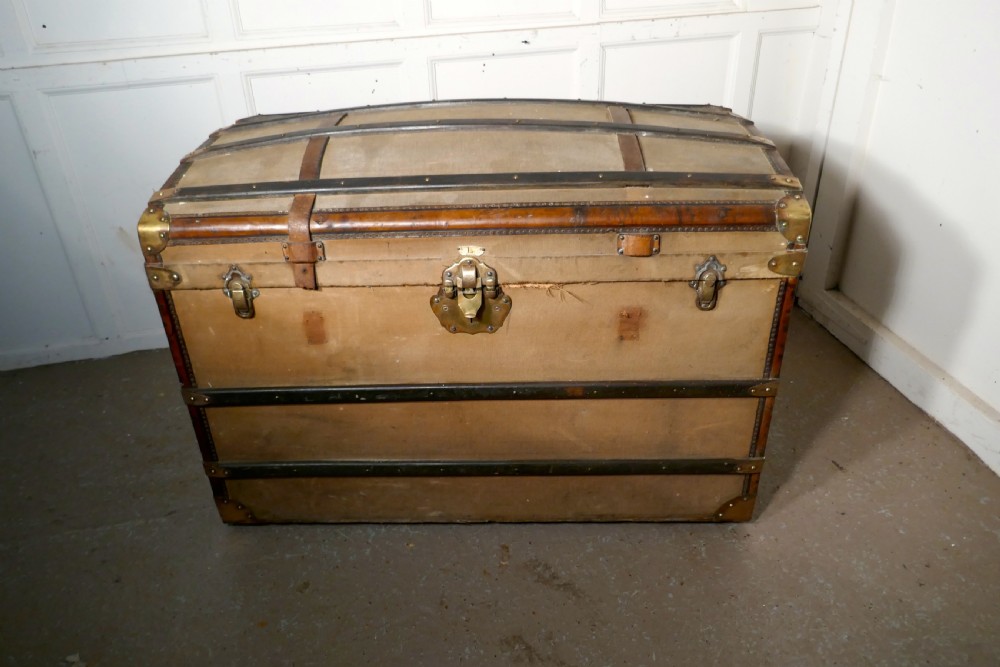A Large 19th Century French Canvas Dome Top Travel Trunk, Lion Brand View VII