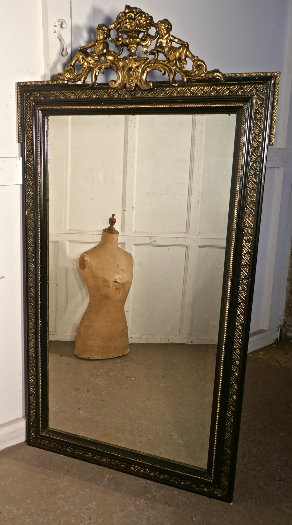 Large French Ebonised and Gilt Wall Mirror, Reclining Cherubs Crest 