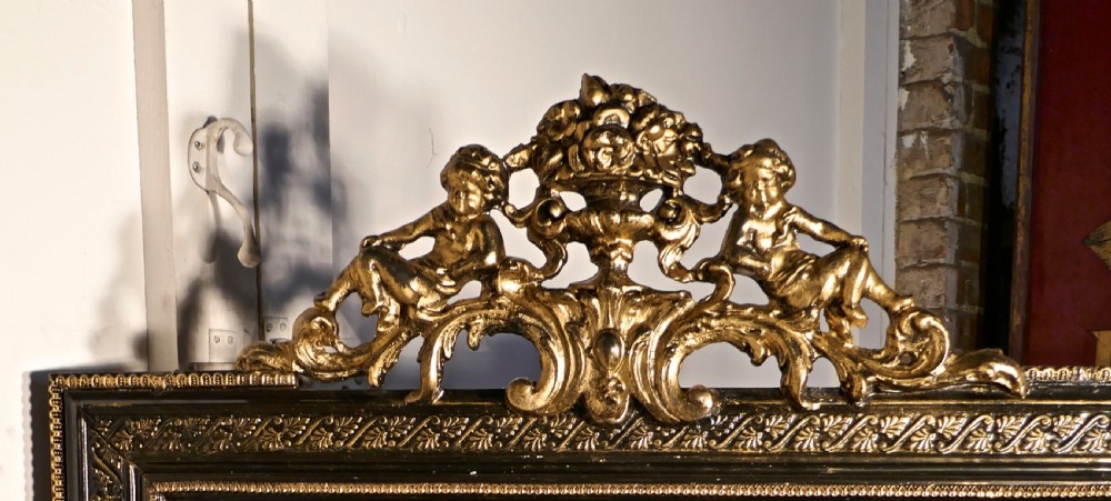 Large French Ebonised and Gilt Wall Mirror, Reclining Cherubs Crest  View V