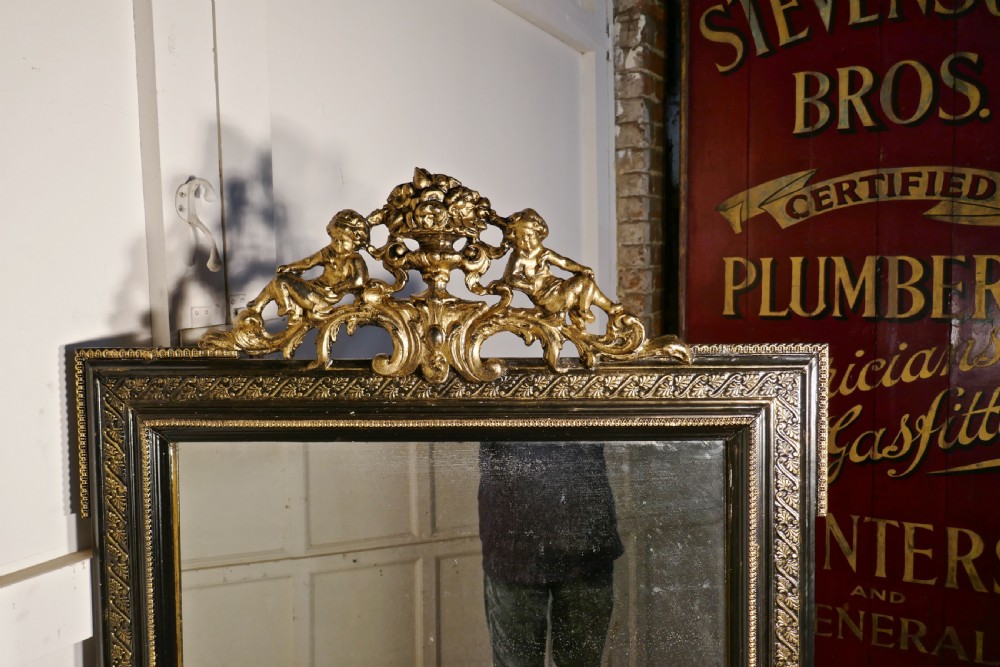 Large French Ebonised and Gilt Wall Mirror, Reclining Cherubs Crest  View VI