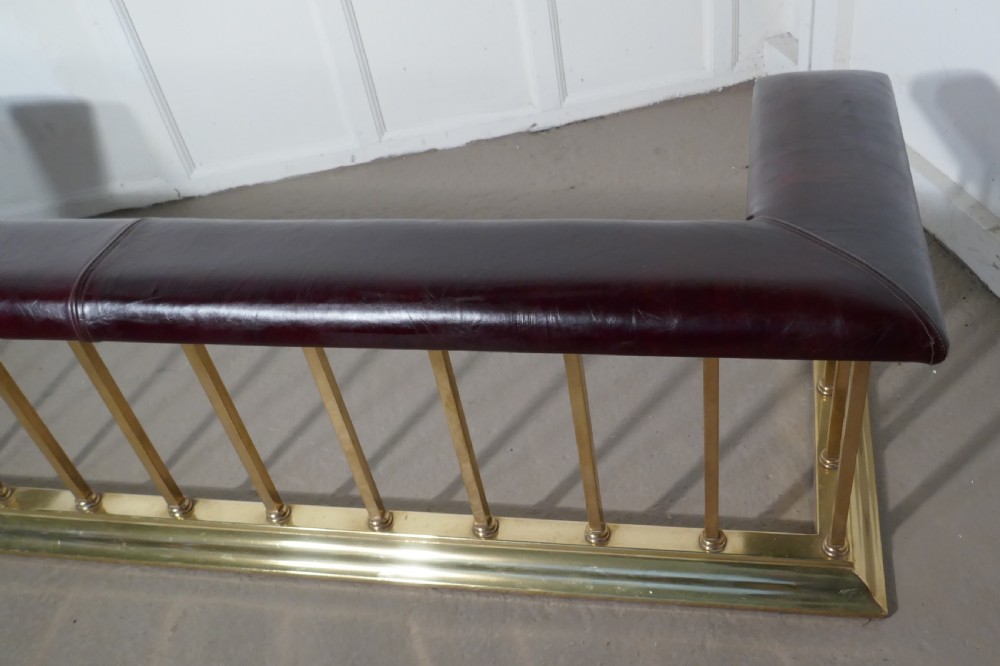 A Large Brass and Leather Club Fender View III