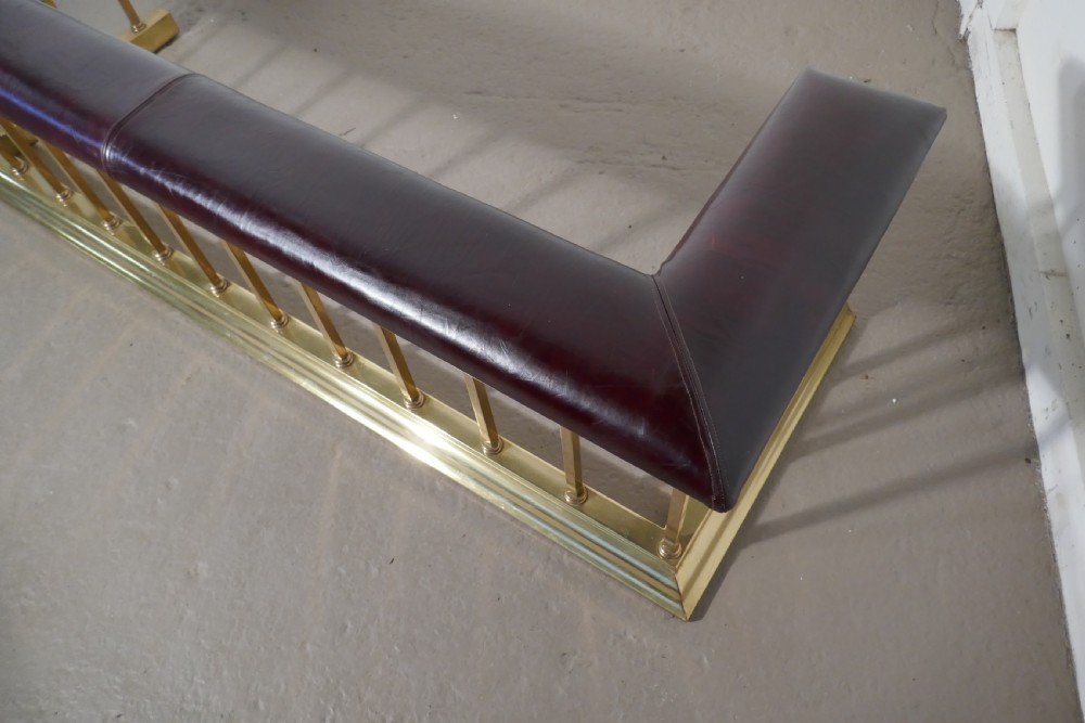 A Large Brass and Leather Club Fender View V