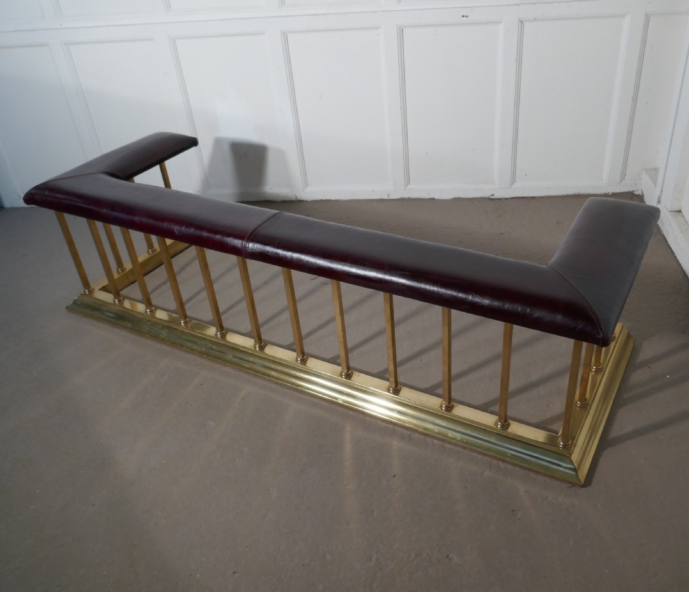 A Large Brass and Leather Club Fender View VI