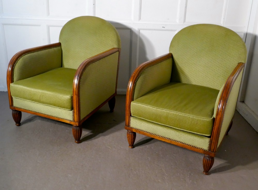A Pair of French Art Deco Walnut Upholstered Club Chairs View II