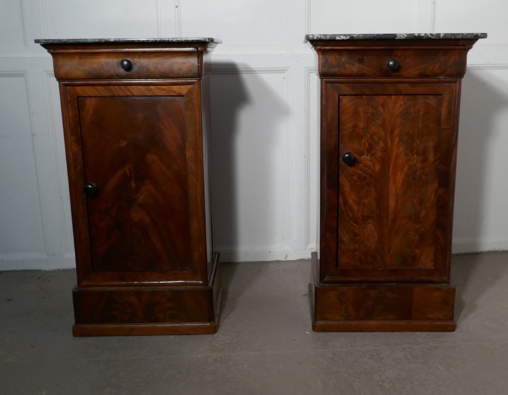 A Pair of Figured Mahogany Bedside Cupboards View II