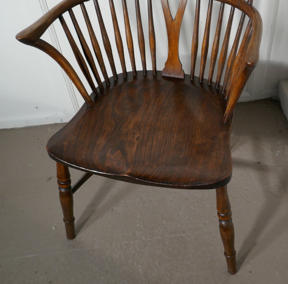 A Georgian Elm and Ash Wheel Back Windsor Carver Chair View II