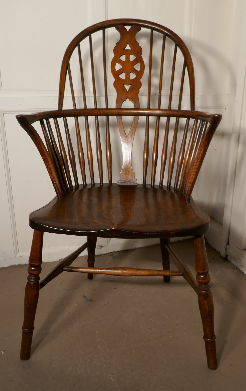 A Georgian Elm and Ash Wheel Back Windsor Carver Chair