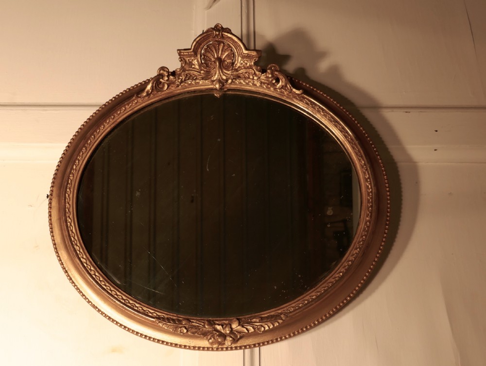 A Rare Pair of 19th Century Regency Style Oval Gilt Mirrors View VI