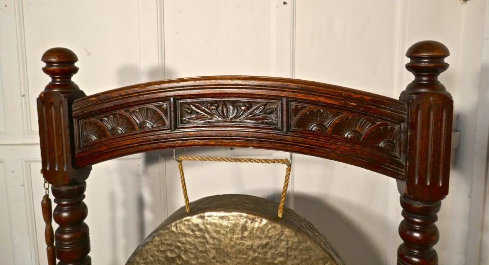 A Large Gothic Carved Oak and Brass Dinner Gong View III