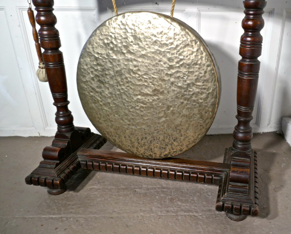 A Large Gothic Carved Oak and Brass Dinner Gong View II