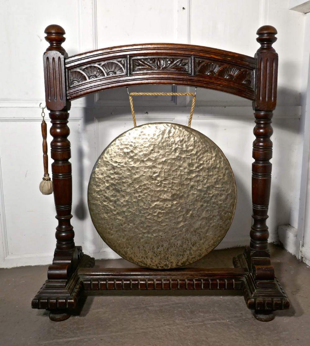 A Large Gothic Carved Oak and Brass Dinner Gong