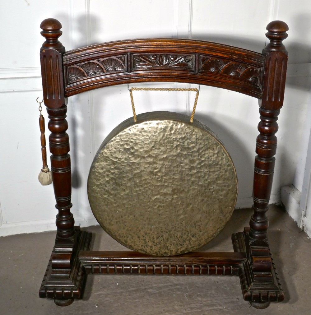 A Large Gothic Carved Oak and Brass Dinner Gong View IV