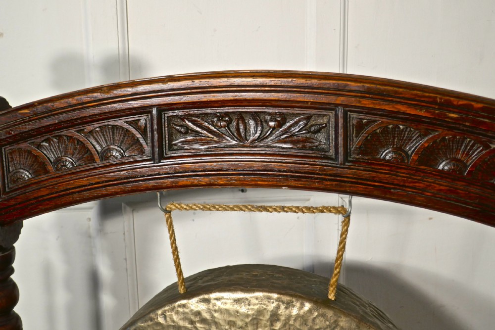 A Large Gothic Carved Oak and Brass Dinner Gong View VI