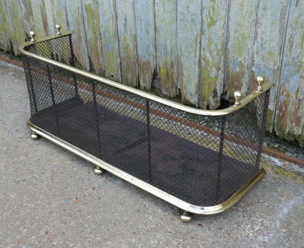 A Victorian Brass and Iron Club Fender