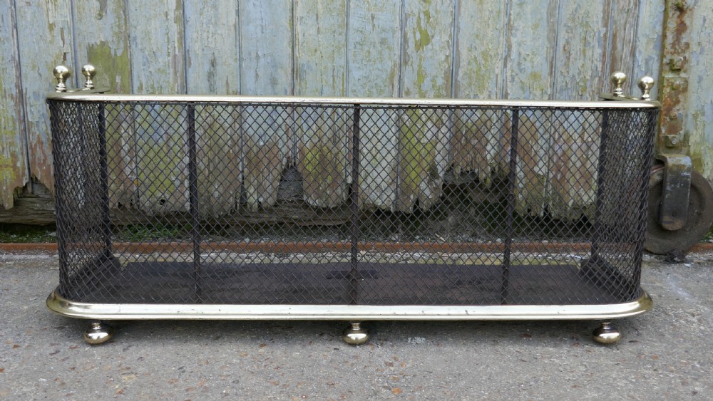 A Victorian Brass and Iron Club Fender View III