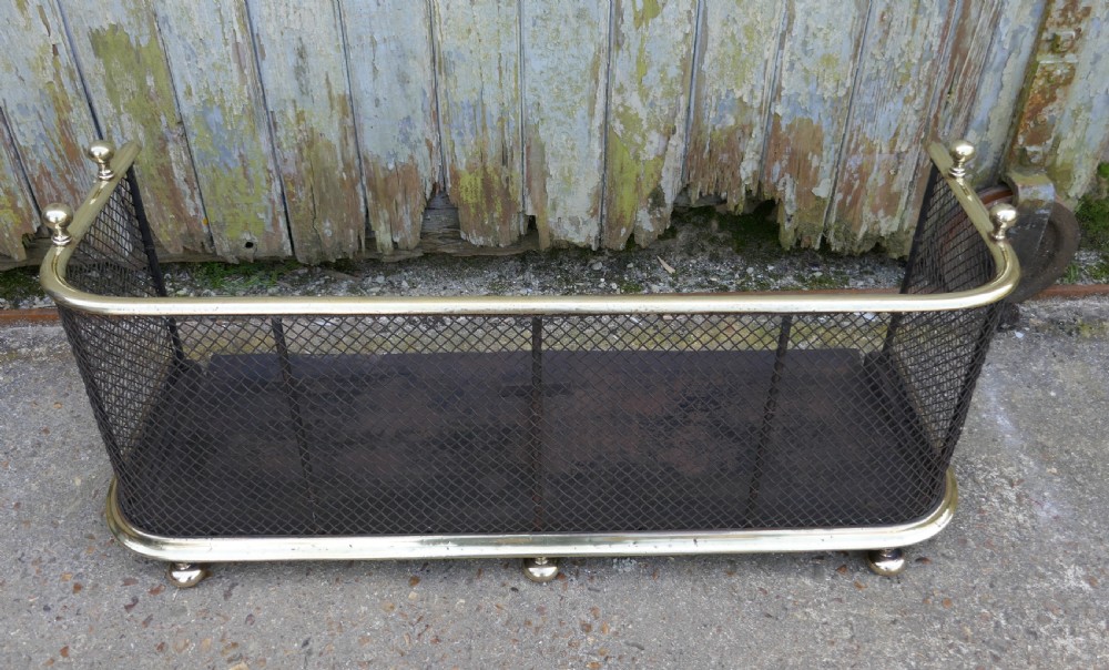 A Victorian Brass and Iron Club Fender View IV