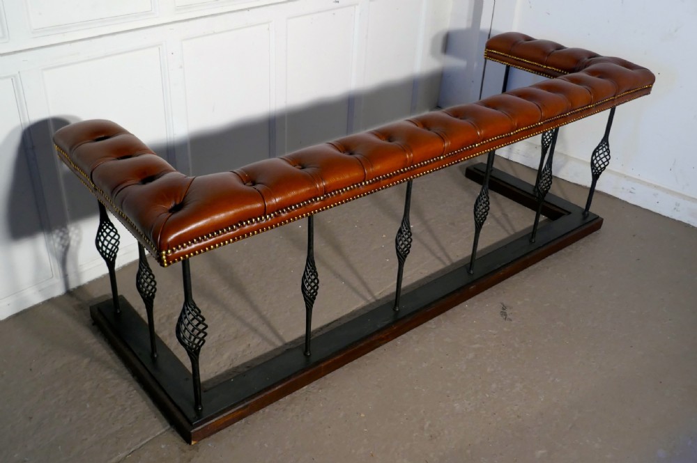 A Large Wrought Iron and Leather Club